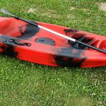 Closeup of red kayak with paddle