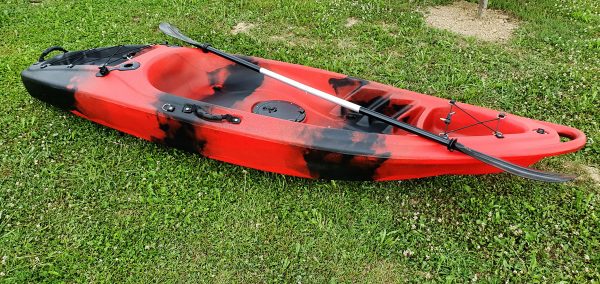Closeup of red kayak with paddle
